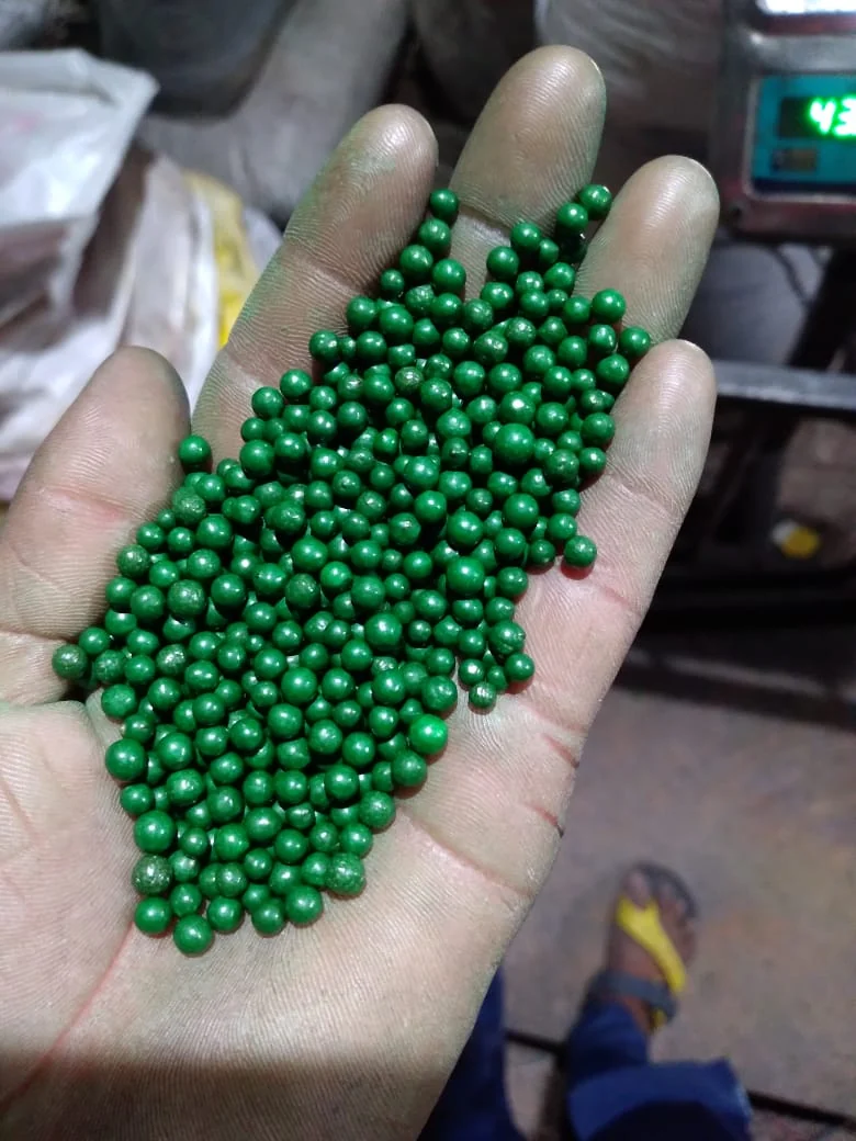 Green granules in hand
