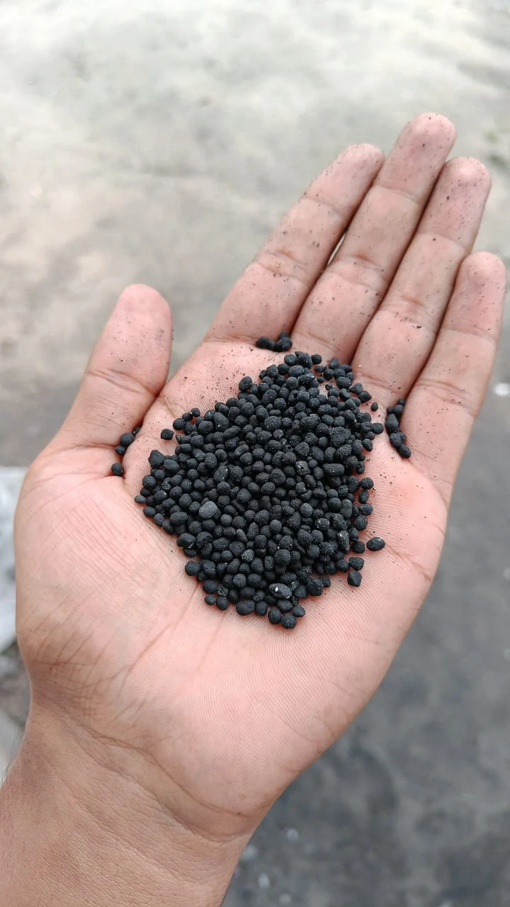 Black Granules - Product sample in hand